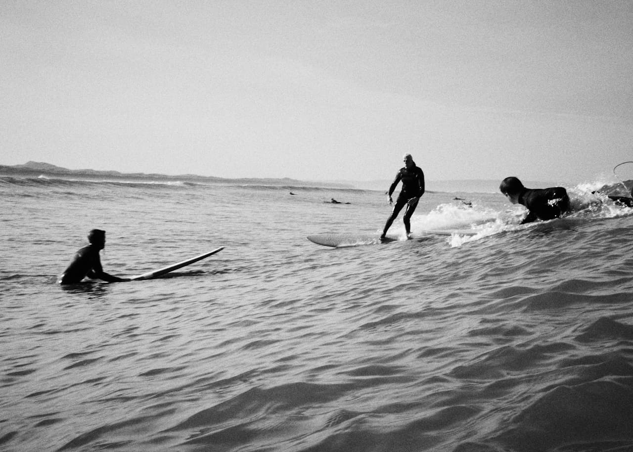 Surf group on the beach with boards